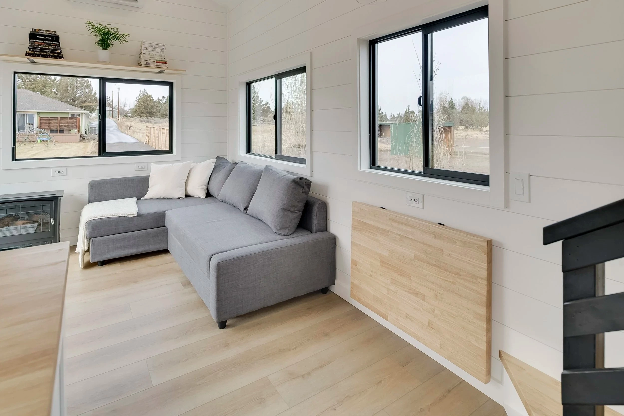 The Ochoco's living room includes a large L-shaped sofa bed
