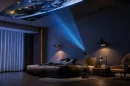 The hinged projector head can be angled to throw imagery on walls or ceiling