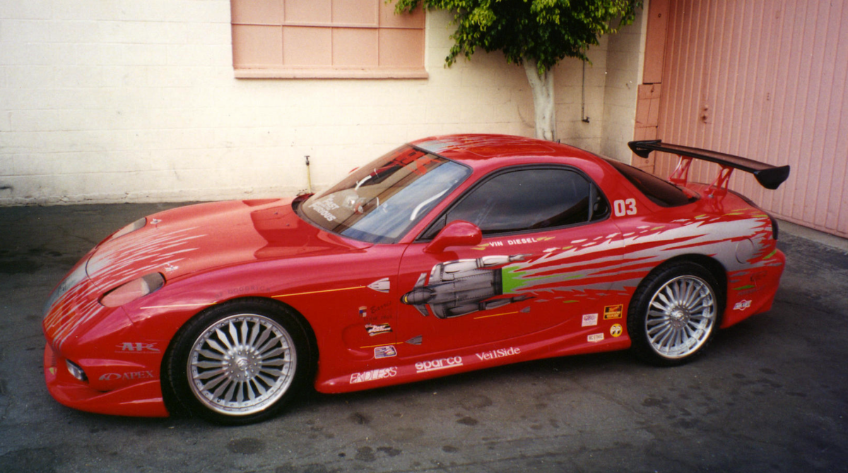 In May, 2005, the twin turbo 1993 Mazda RX7 driven by Vinny Diesel in The Fast & The Furious (2001) sold at a Bonhams auction for $40,250. The car was the real deal, and was used in the film in the main drag sequence against Walker’s Eclipse and in the escape from the police following the drag race. The car has roller wheels installed under the front spoiler so that when Diesel pushes it hard up into the steep incline of the parking garage, the front end sustains no damage. In September, 2007, another of Diesel's Mazda turbo RX-7s from Fast & the Furious sold for $23,500.
