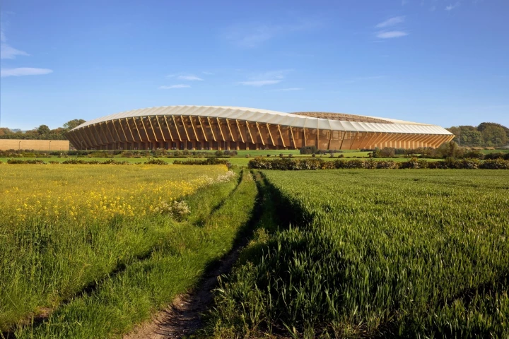 The new Forest Green Rovers stadium will take the form of a continuous spectator bowl with a low profile, sweeping curves and a wooden skeleton