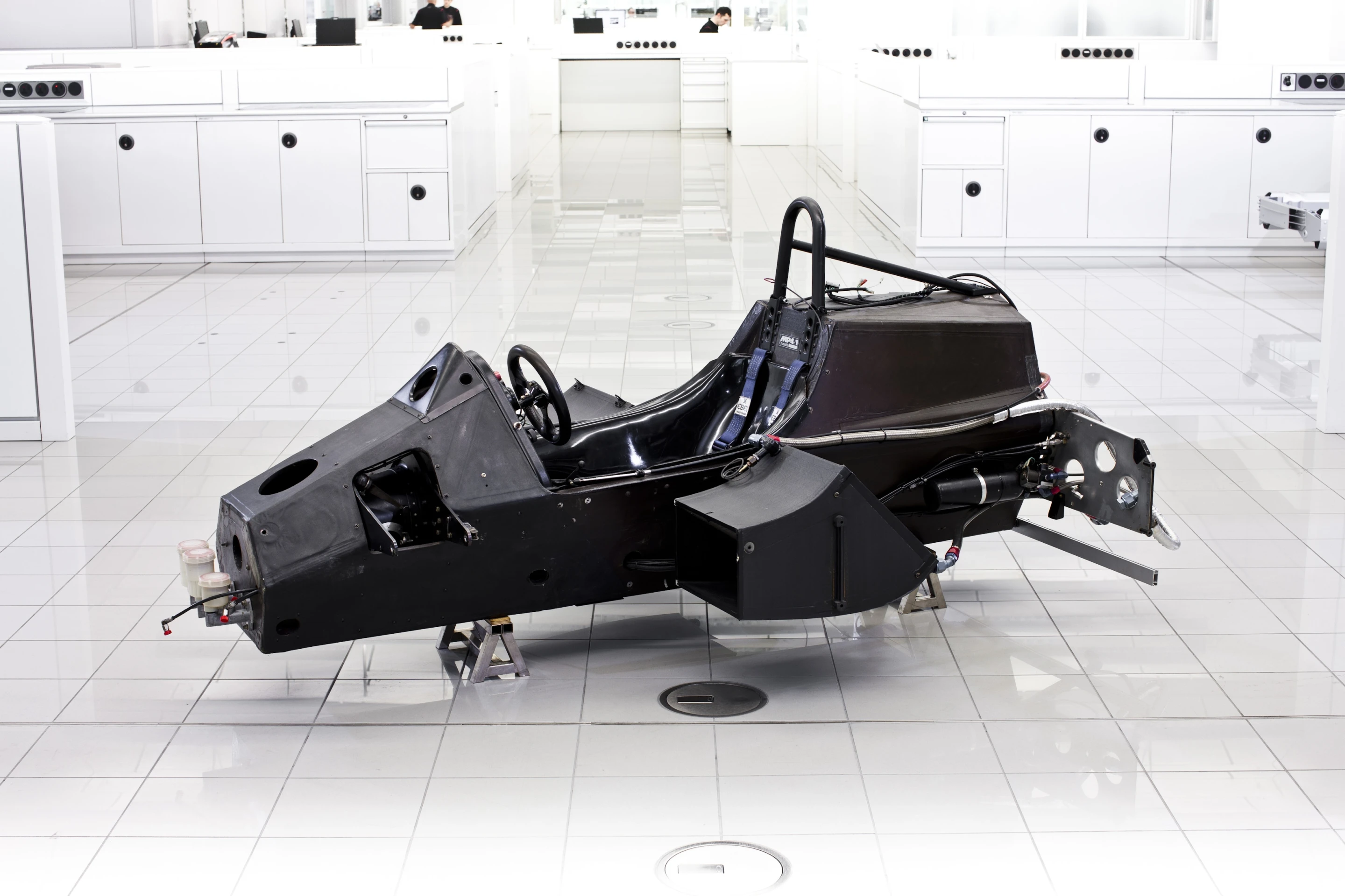 MP4/1 carbon fiber monocoque, or driver space, carries chassis stress, is lighter and stronger than metal and acts as a mounting point for several critical components