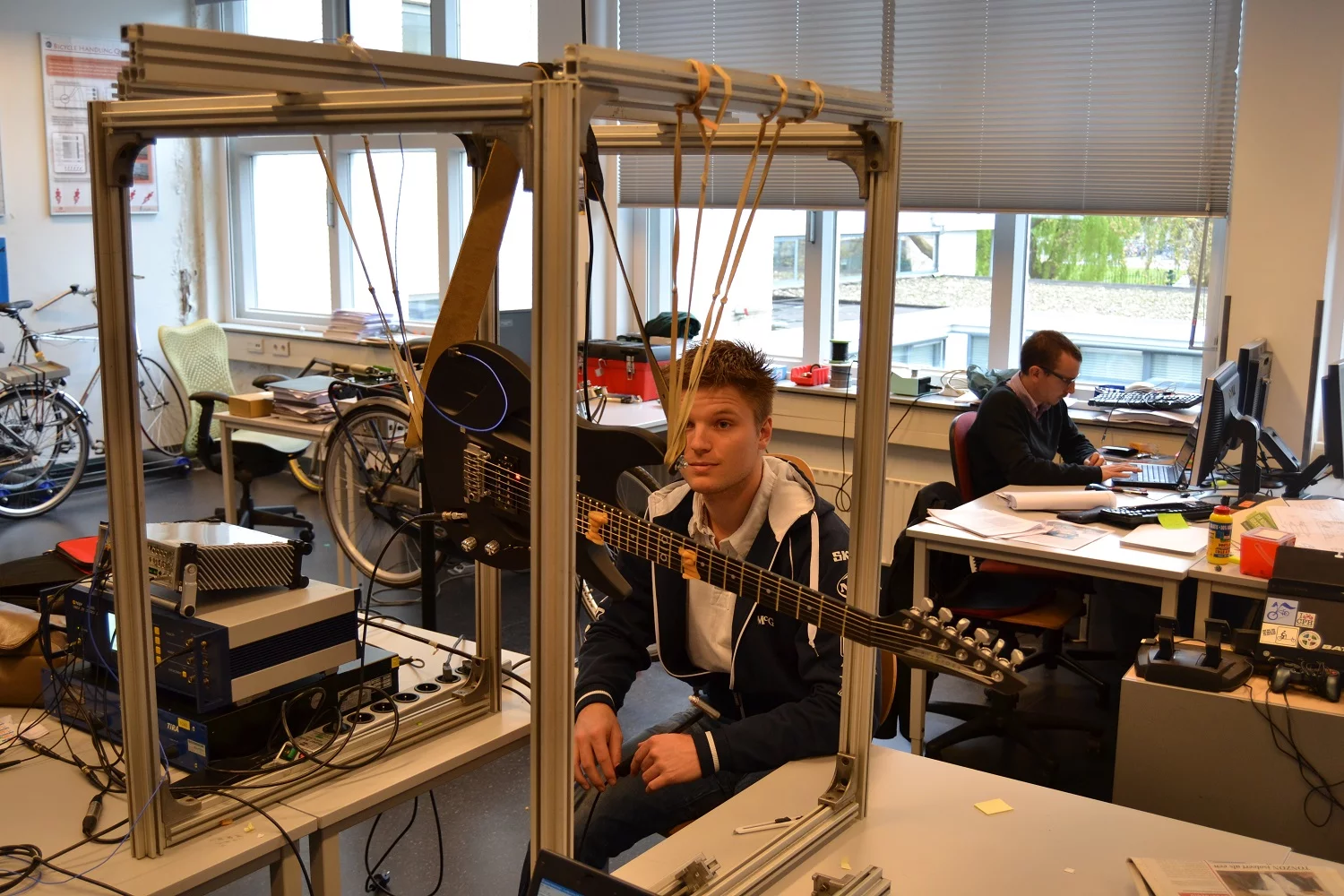 An Aristides Arium guitar undergoing acoustic testing