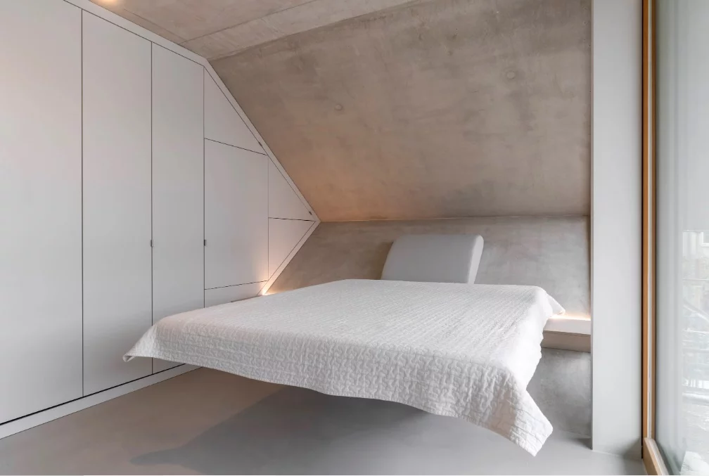 The bedroom features a built-in floating bed and wardrobe space