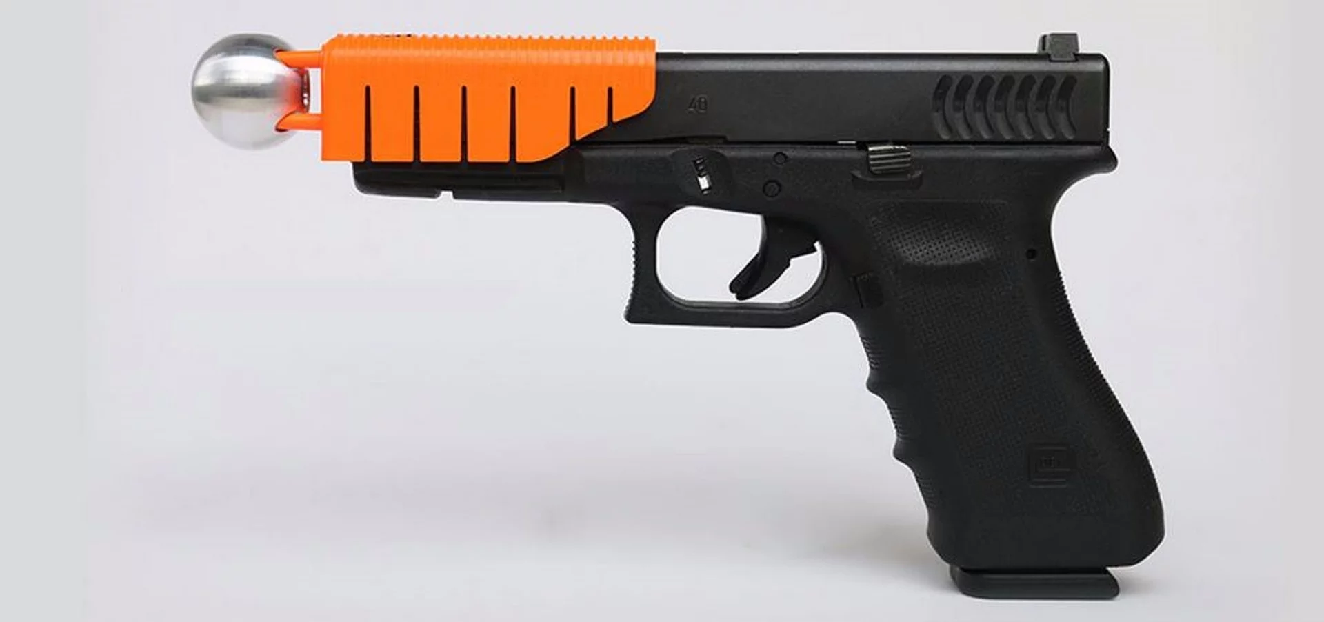 The Alternative hooks onto a standard semiautomatic pistol to reduce the velocity of a fired round