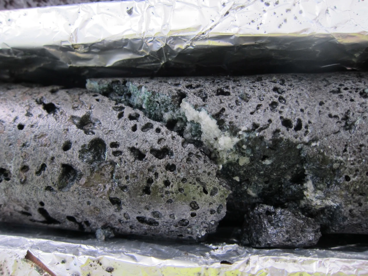 Basalt core containing carbonates - the white mineral is the CO2