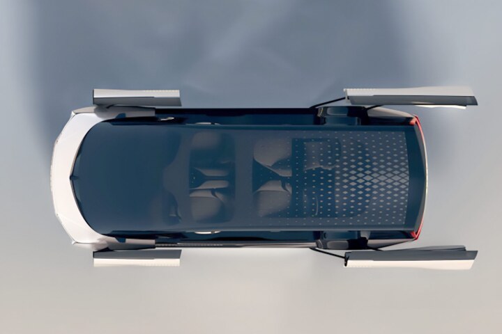 The E08's doors can be seen from above, with the driver and passenger doors moved forward and flat with the side of the vehicle.
