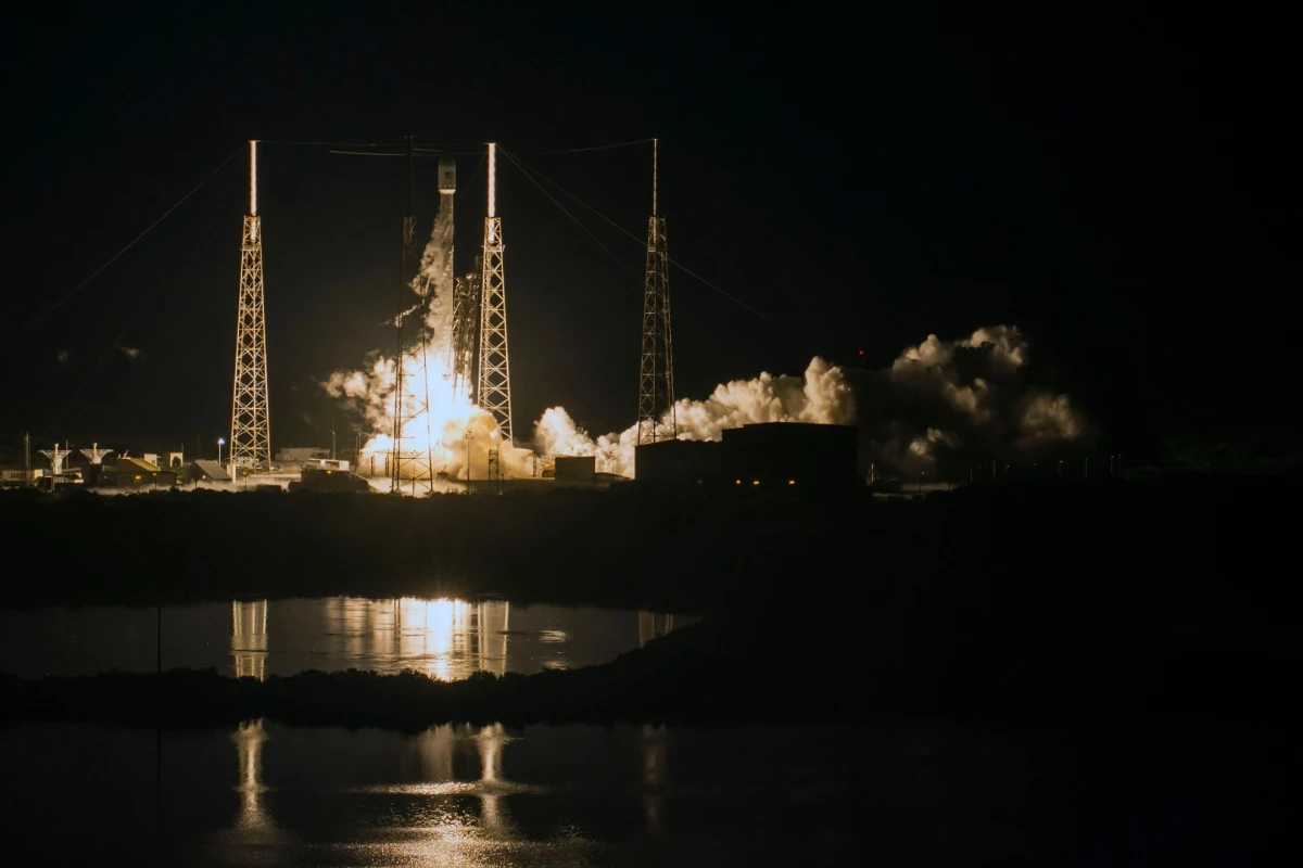 A Falcon 9 booster lifting the JCSAT-16 mission.