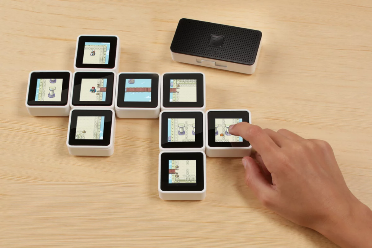 The Sifteo Cubes Intelligent Play system has been updated so that up to 12 blocks can be used at any one time (instead of 6 previously) and now includes a new Sifteo Base that adds portability to gameplay