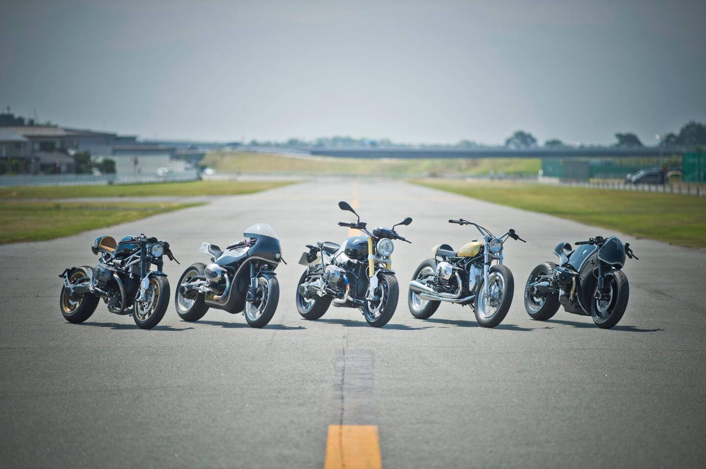 The four Project nineT Custom bikes, with a stock R nineT in the center