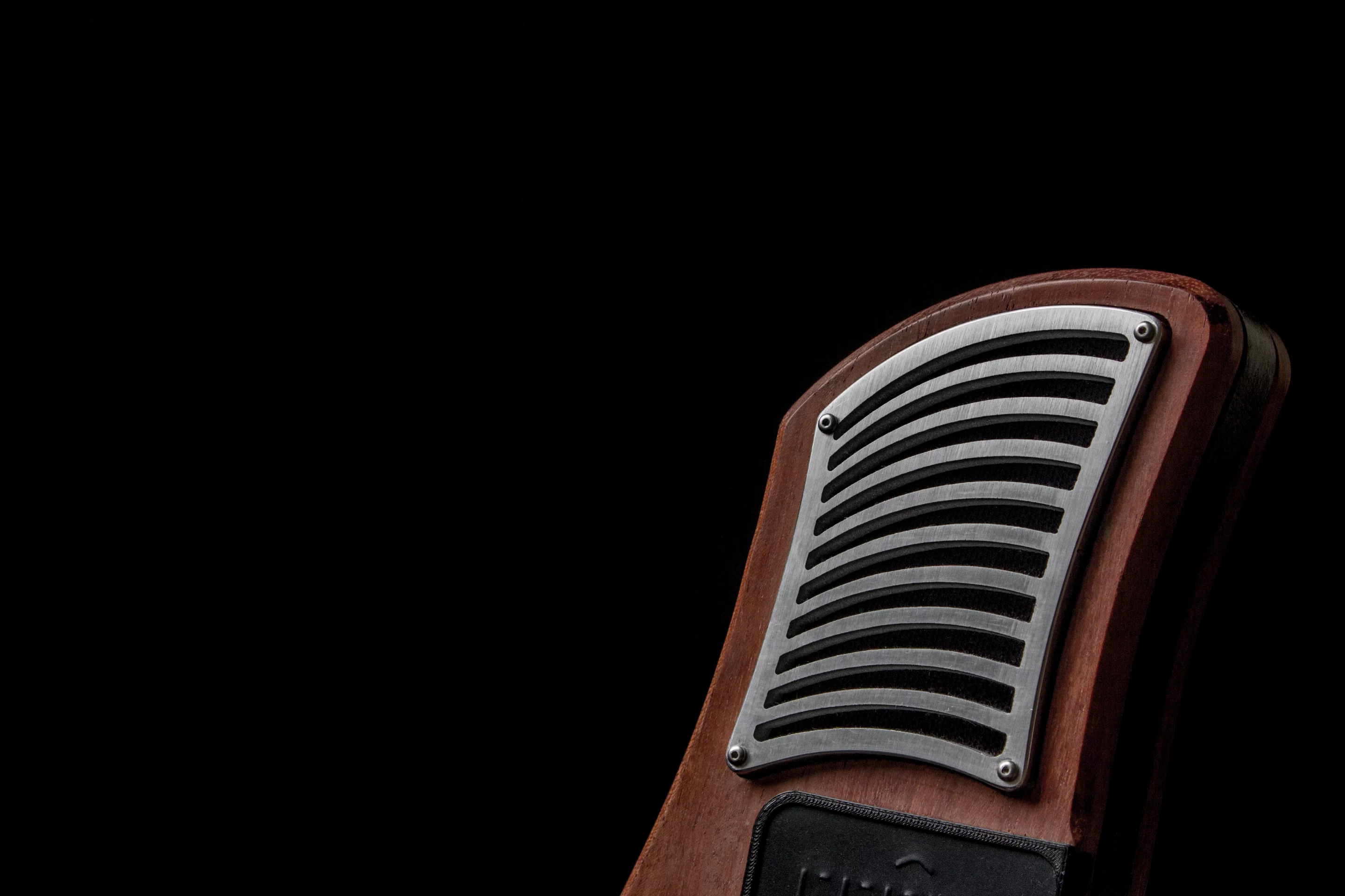 At either end of the ergonomic body fashioned from sustainably-harvested hardwoods and bamboo are BMR speakers