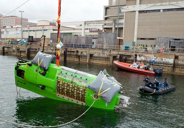 James Cameron's DEEPSEA CHALLENGER sub is lowered into Australia's Sydney Harbor from the vessel Mermaid Sapphire(Photo: Brook Rushton/National Geographic)