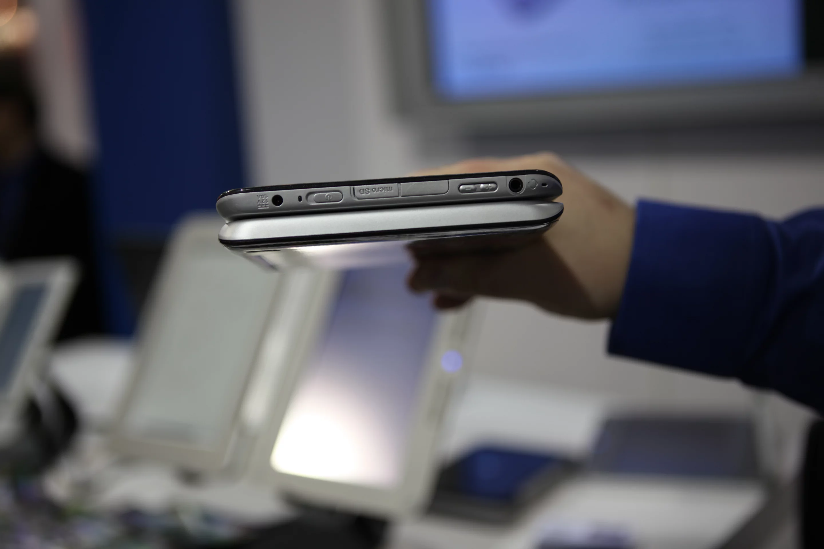 The top edge, showing headphone jack, power button and card slot