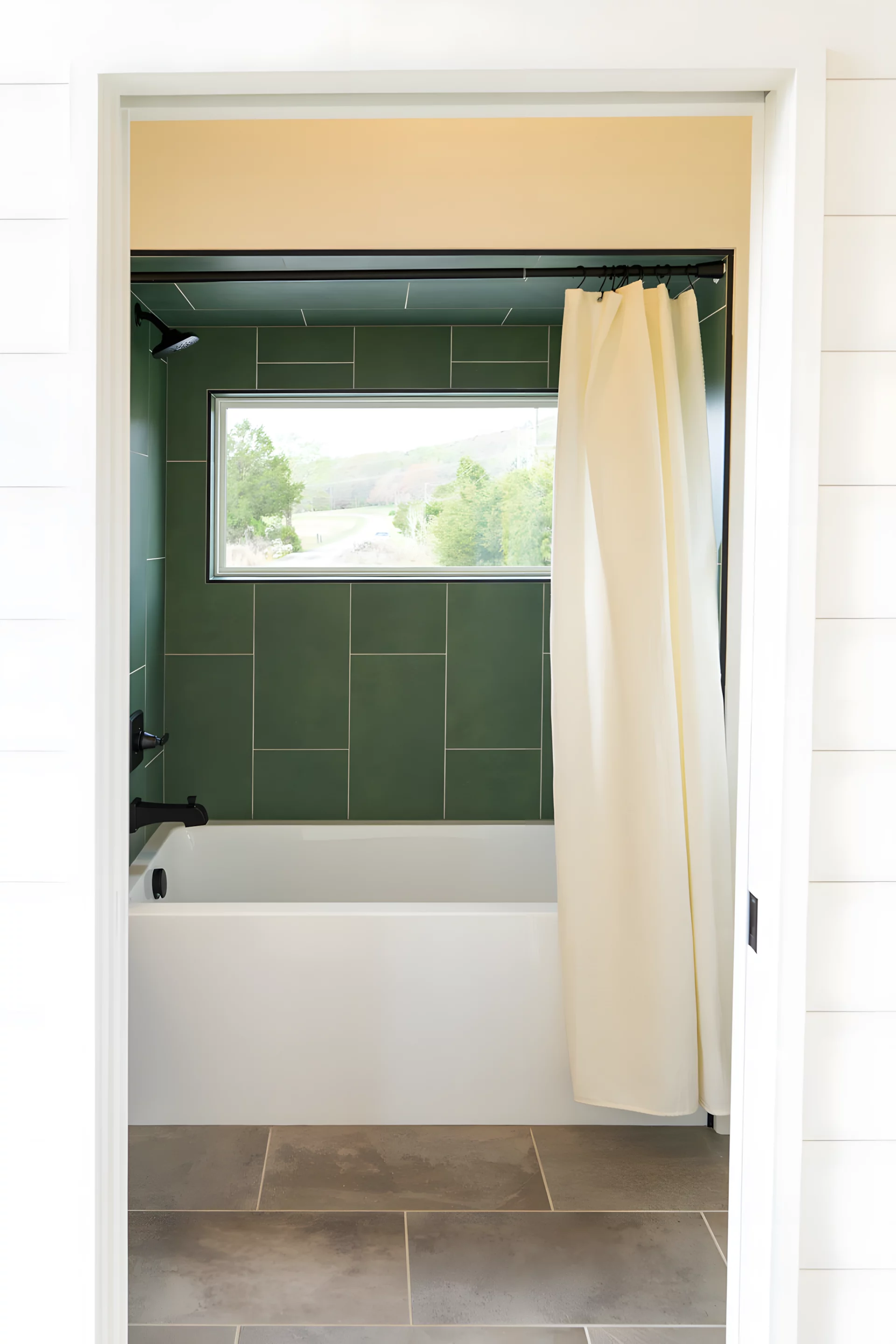 The Rutledge's main bathroom includes a sink, toilet, and a bathtub/shower