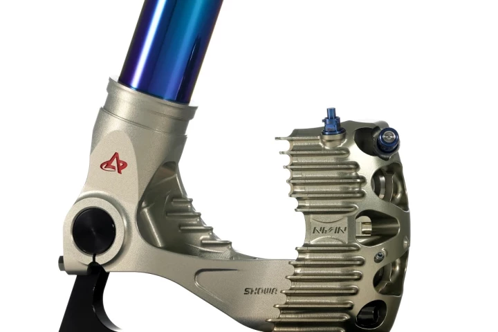 In this design, both the caliper and the bottom of the fork leg are machined from a single billet