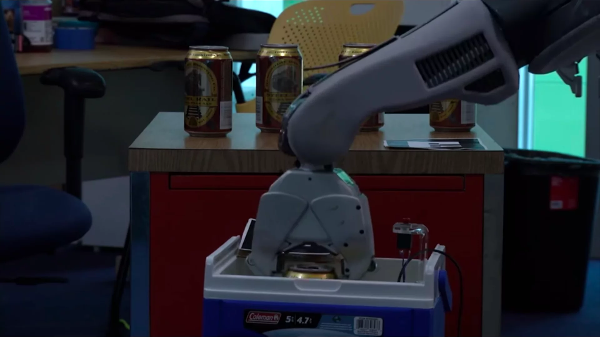 The humans would push a button on the robot to request a drink, prompting the robot to return to the "bar" where a PR2 robot was waiting to dispense cans of beer
