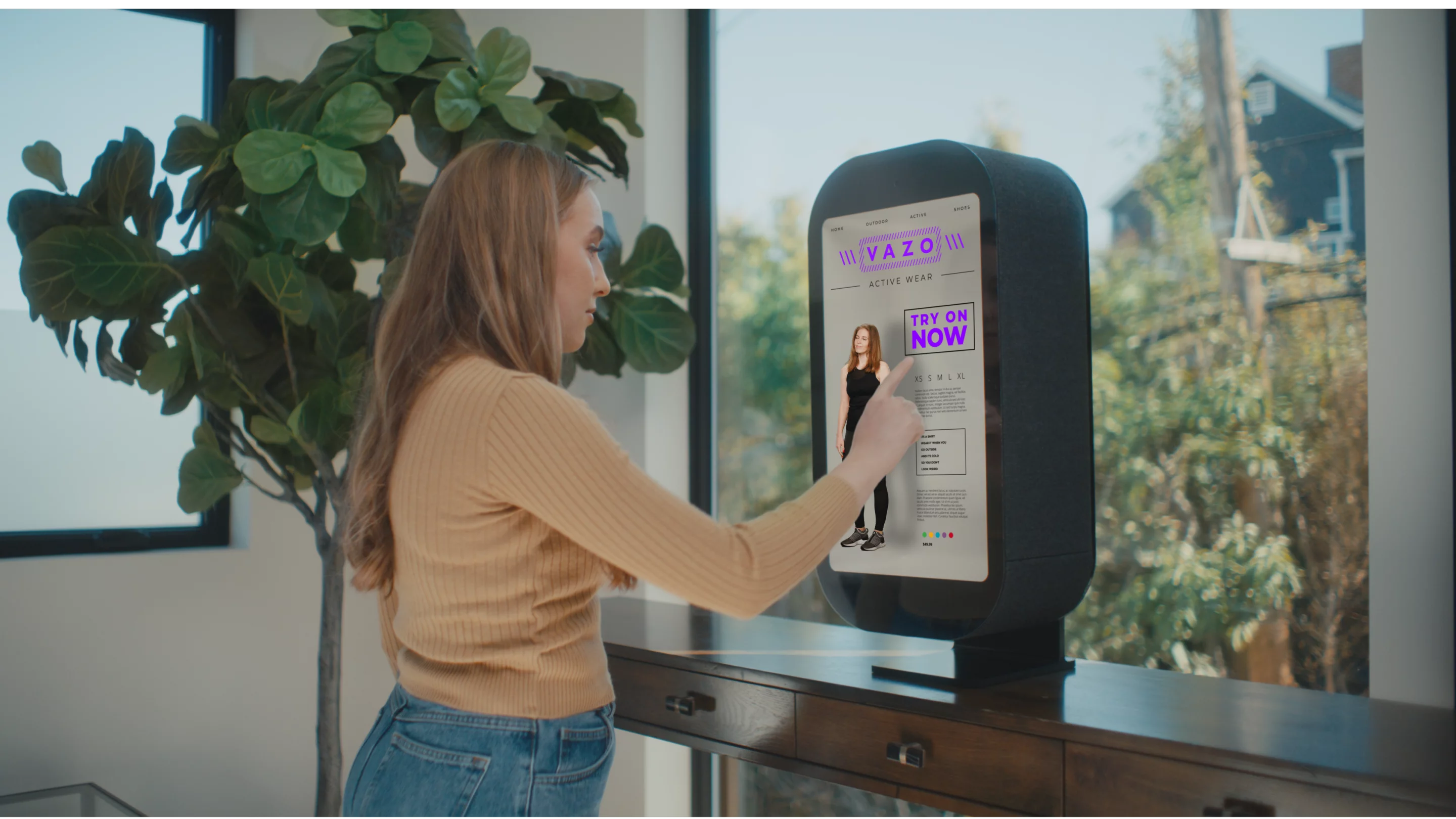 The idea here is that you can shop online, click on an onscreen button and the M by Portl can create a hologram of you wearing your selected item of clothing