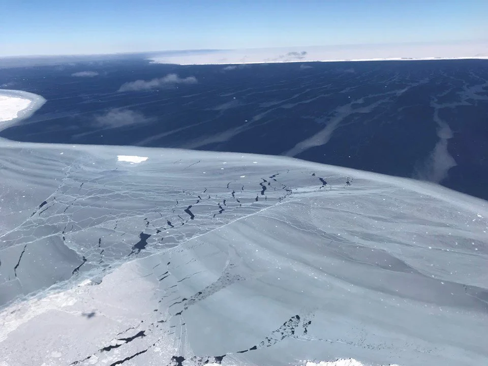 Looking out from the sea ice to iceberg A68