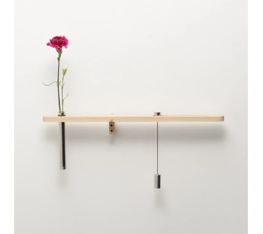 Water Balance sitting horizontally, showing that the flowers in the vase have been fed recently
