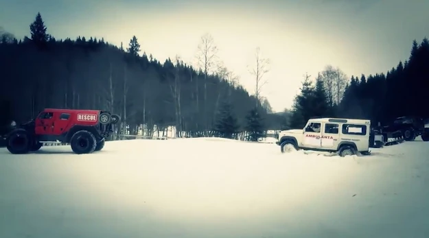 Friendly competition: The Rescue tows a Land Rover out of the snow