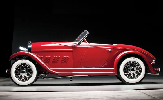 Auburn Boat-tail Speedster Electric Pedal Car. Hand-made in amazing detail, features include "Firestone" white-wall tires, spoked wheels, two-tone red paint, working lights, tan leather seat, fully instrumented engine-turned dash and beautiful raked windshield. Wheelbase: 43 inches. Too good for the kids. Besides, they mightn't be able to come up with the US$10,000 - 15,000!