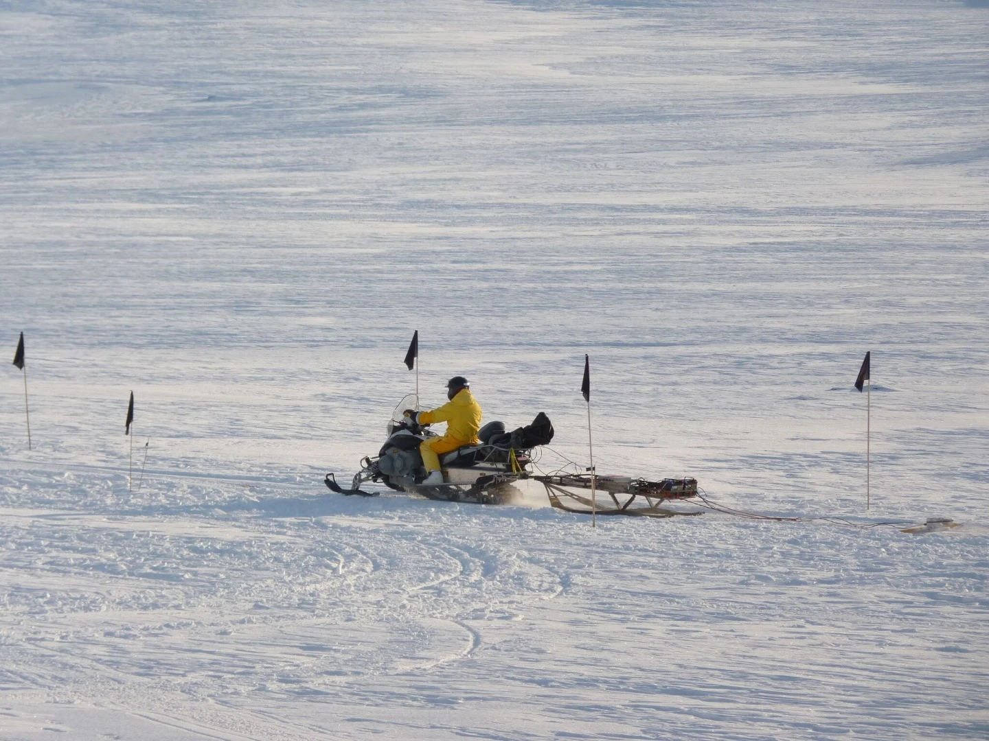 The purpose built "metal detector" being dragged behind a Ski-Doo