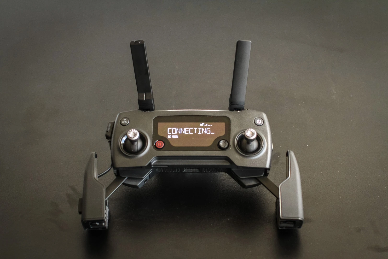 DJI Mavic Pro: controller has its own small LCD, plus a pair of arms to hold your mobile phone