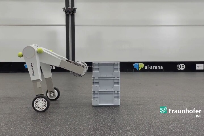 The evoBOT prepares to grasp and carry a plastic crate
