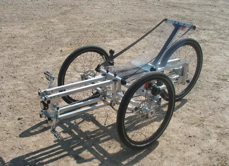 The plans position the wheels and chains within the frame and at a distance from the rider