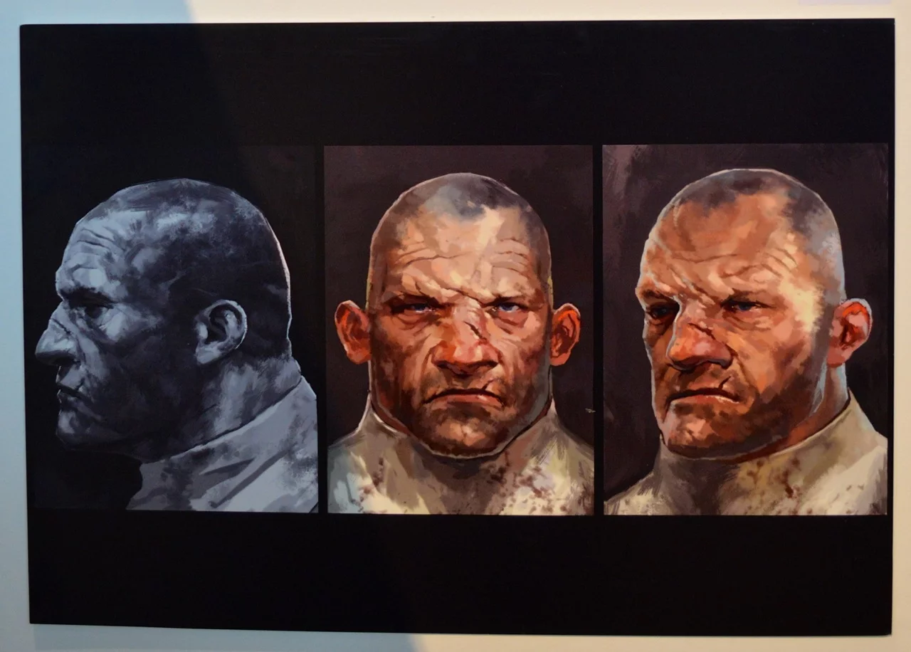 The art style of the Dishonored character portraits is unmistakable, even as you descend the curving ramp to City Hall's lower ground floor housing the exhibition