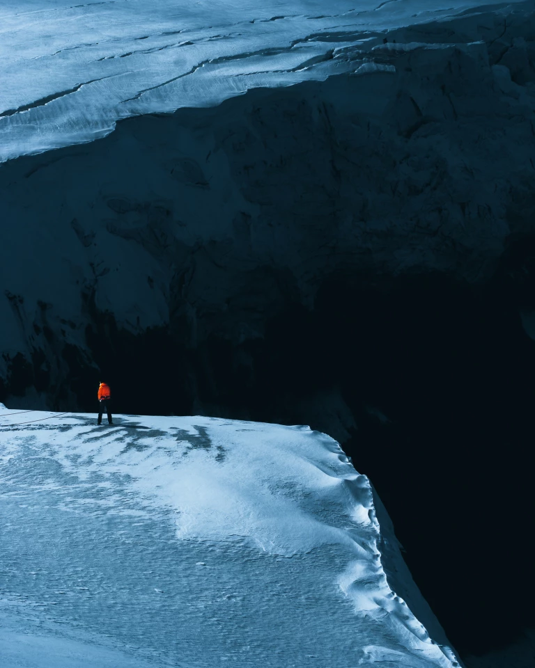 Above. Strapped in and standing above a big cliff. Watching the glacier go over the edge and fall 200 meters to the ground.