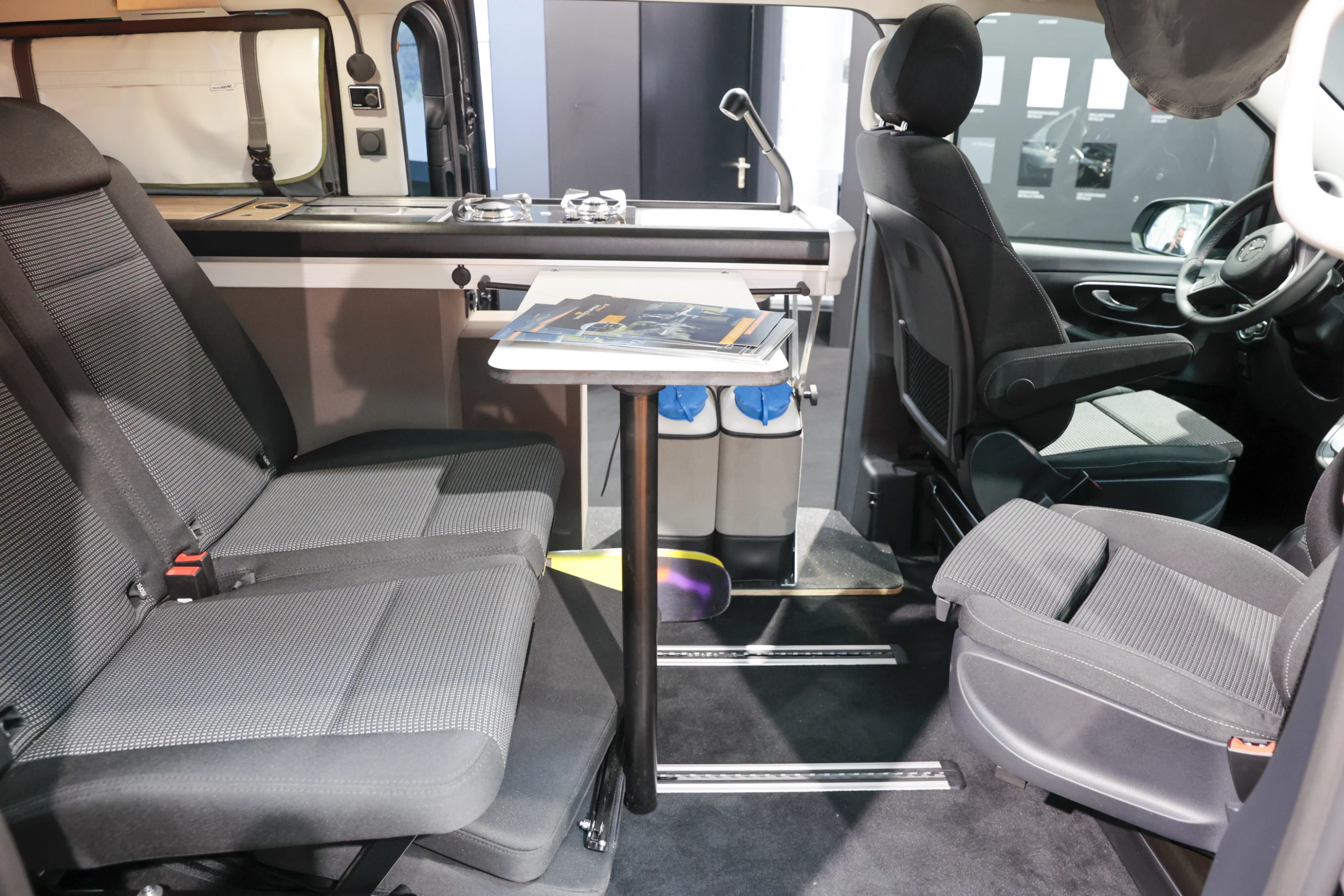 The VanTourer Urban X includes a lightweight kitchen block with open underside, a dining table/desk, floor rail-mounted rear seats and swivel front seats