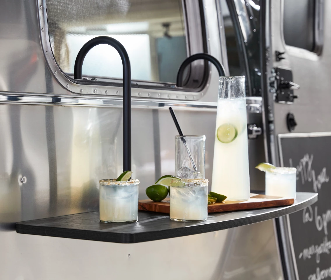The new hanging outdoor shelf makes a natural mini-bar or appetizer table