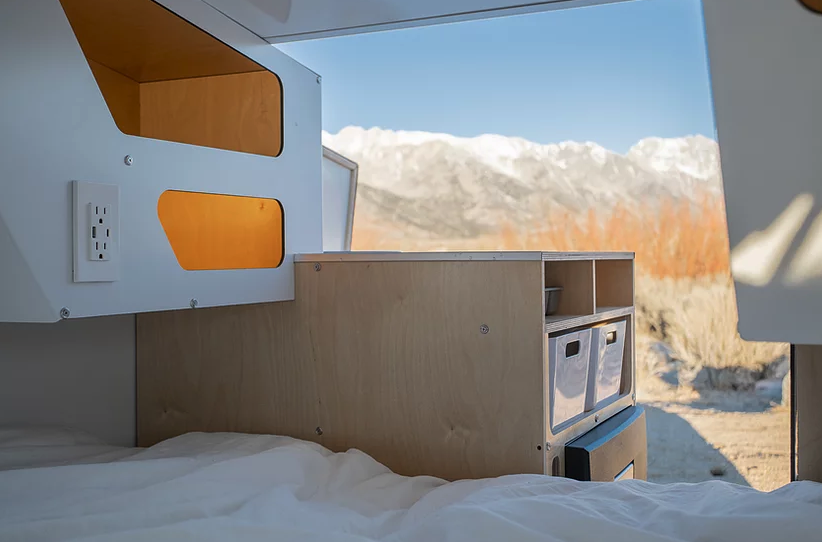 Polydrops' kitchenette is an interesting spin on the teardrop trailer galley, facing the side and taking up only a portion of the tailgate area rather than the whole thing