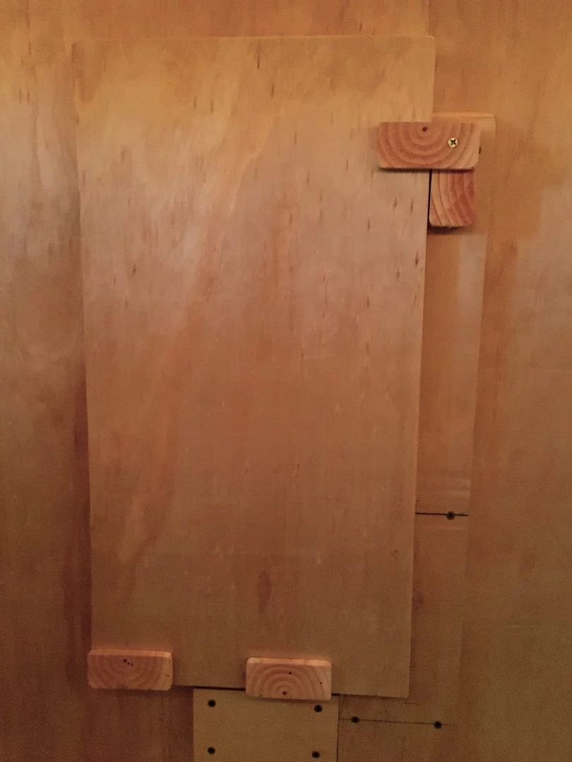 The interior of the Living Pod includes a fold-down desk, a cushioned backboard, and a light