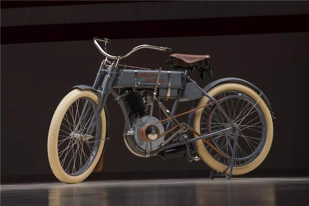 Originally sold as part of the Otis Chandler Collection by Gooding & Co in 2006, the "Strap Tank" was the bike which kick-started the fledgling enterprise of Bill Harley and Arthur Davidson and the bike which sold for US$352,000 price in 2006 would have been built in the first Harley-Davidson factory. The bike was auctioned again in January 2015 by Barrett-Jackson as part of the Ron Pratte Collection fetching US$165,000 - less than half of it's price of eight years earlier.
