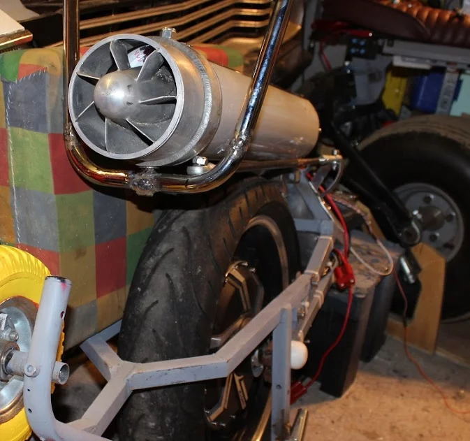 The front of the battery tub on John Dingley's electric unicycle is capped with a jet intake from an old aircraft