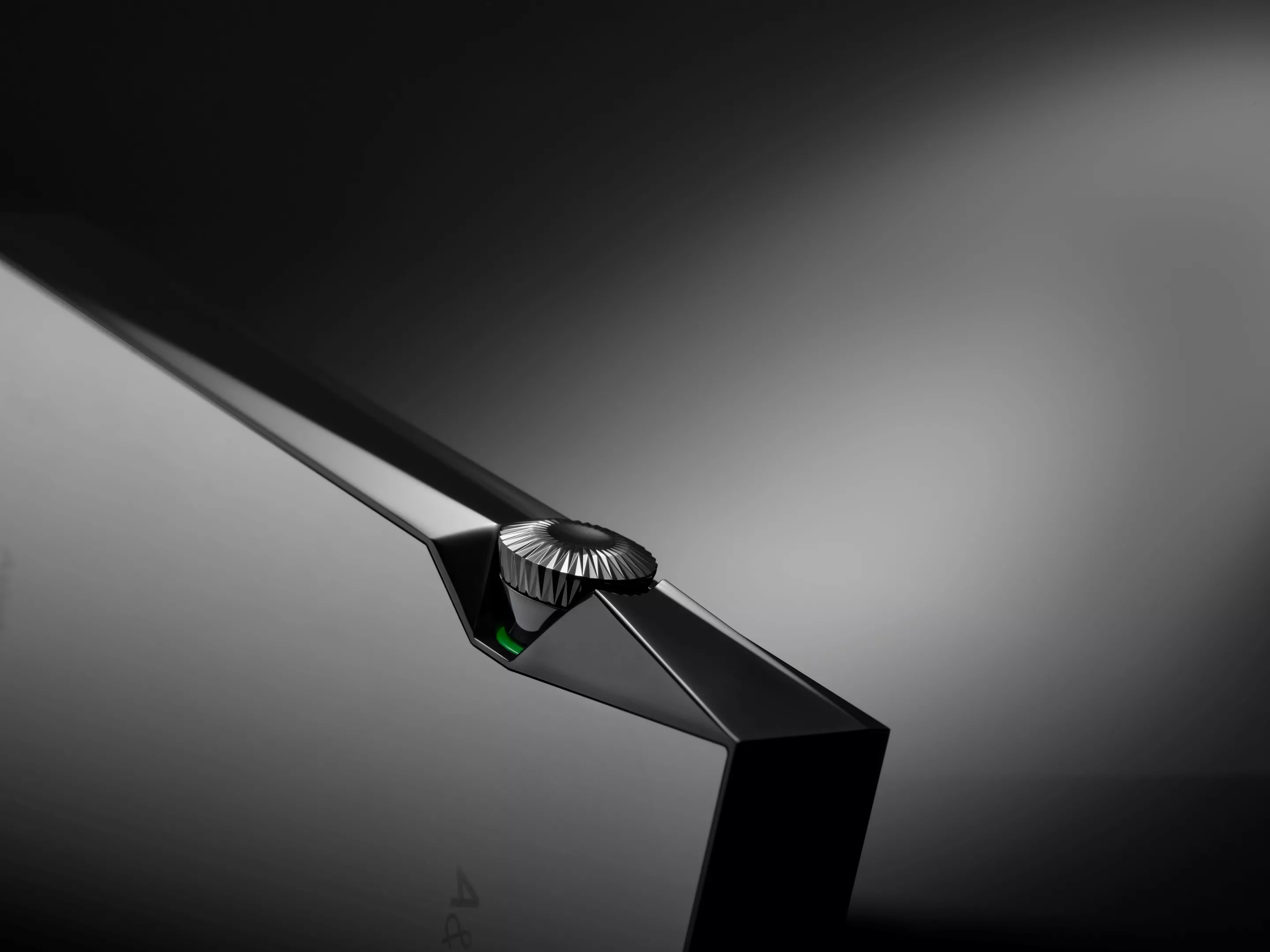 A watch-style crown for volume control matches the watch-grade body material