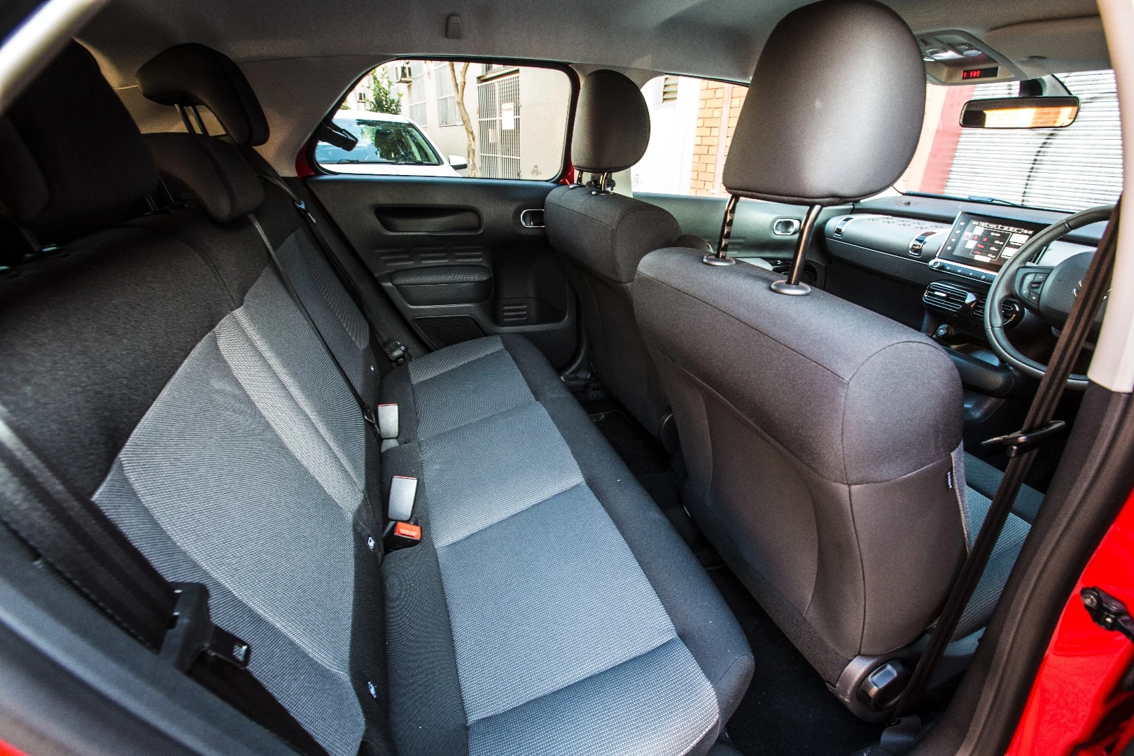Rear seat passengers get plenty of room for legs, although their windows don't roll down all the way.