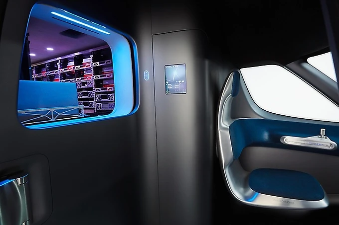 The cargo management system pops the package out through a window into the cabin area as the vehicle arrives at the destination