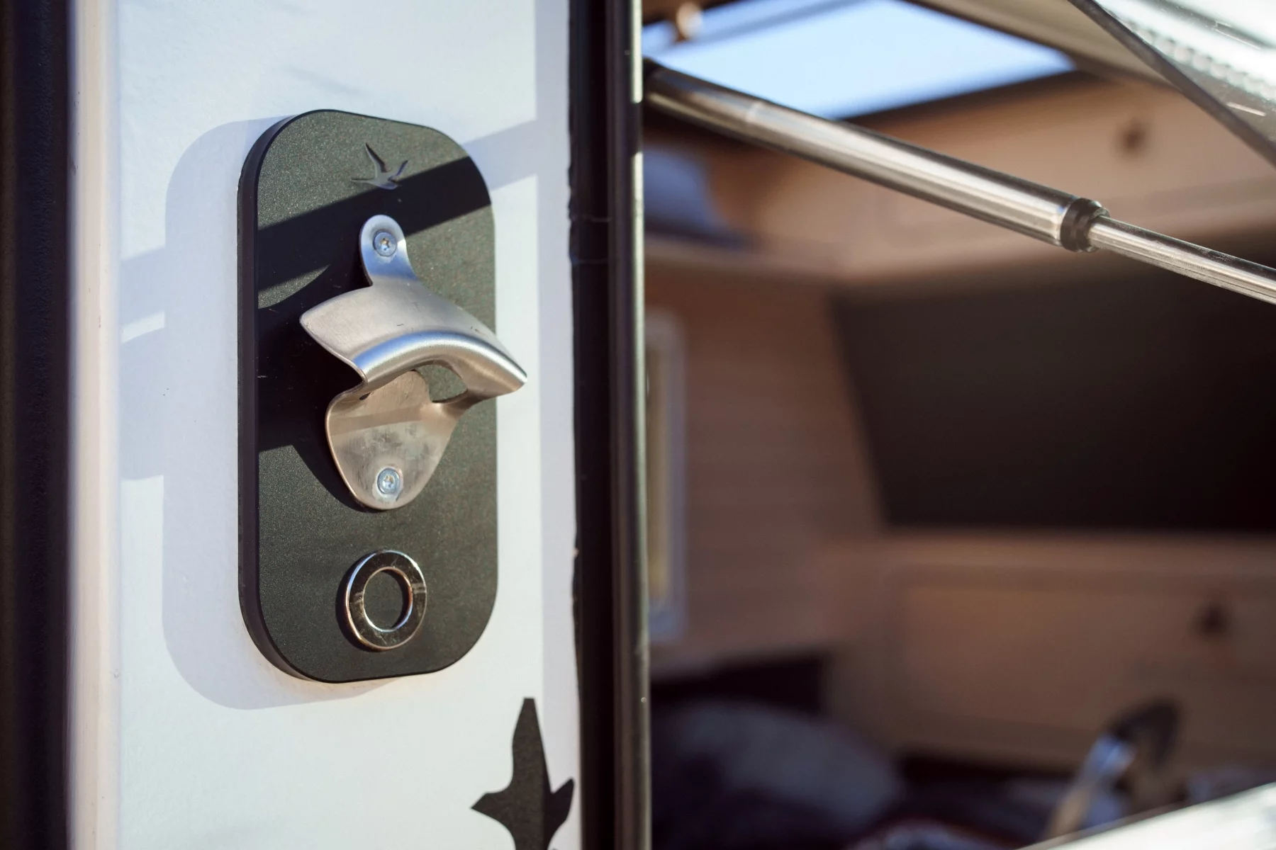 Available bottle opener next to the slide-out kitchen