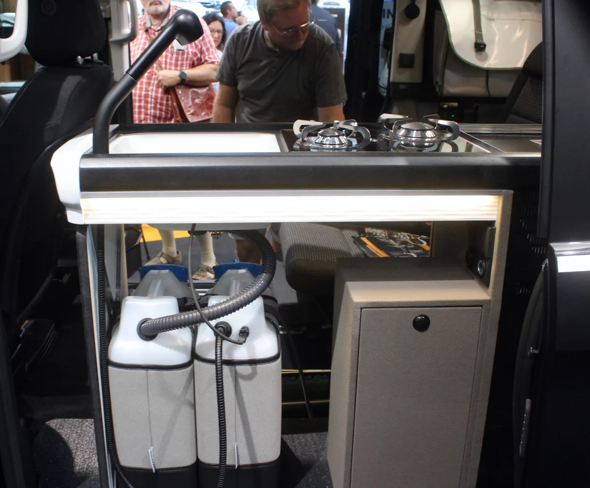 A closer look at the open design of the kitchen area, complete with easily removable water canisters