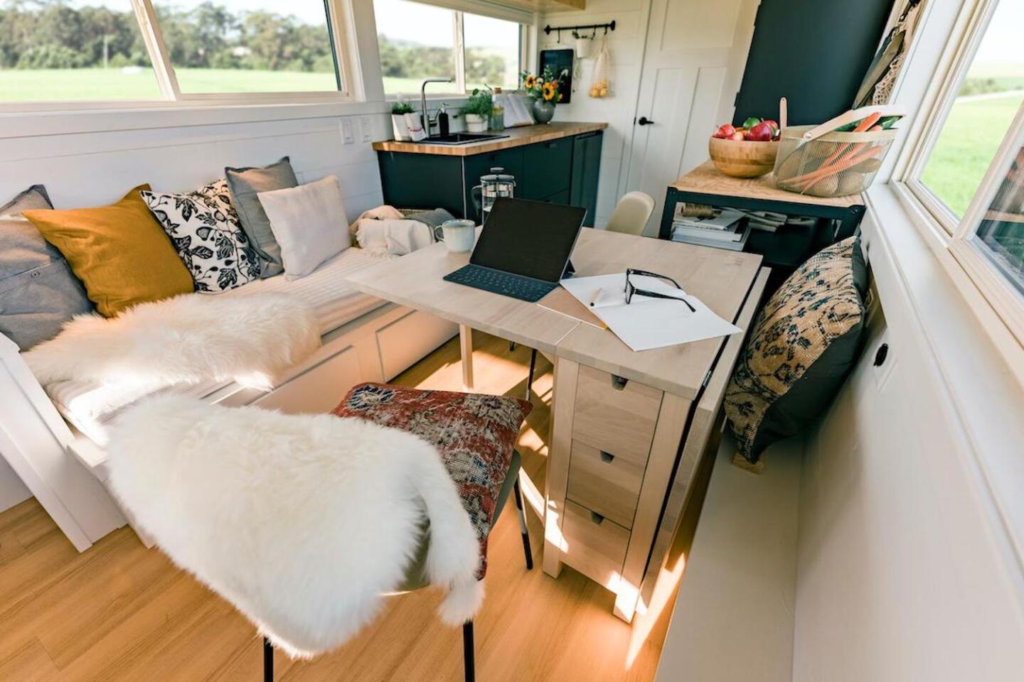 The Ikea Tiny Home Project includes an Ikea folding Norden Gateleg table that serves as both a dining table and a work desk