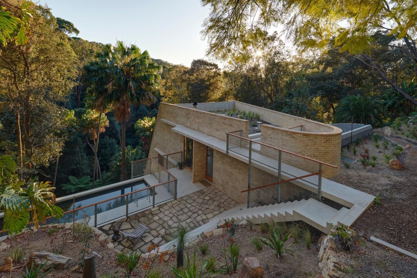 The magnificent Cabbage Tree House, Australian House of the Year, is anchored in a rock shelf near Sydney's northern beaches
