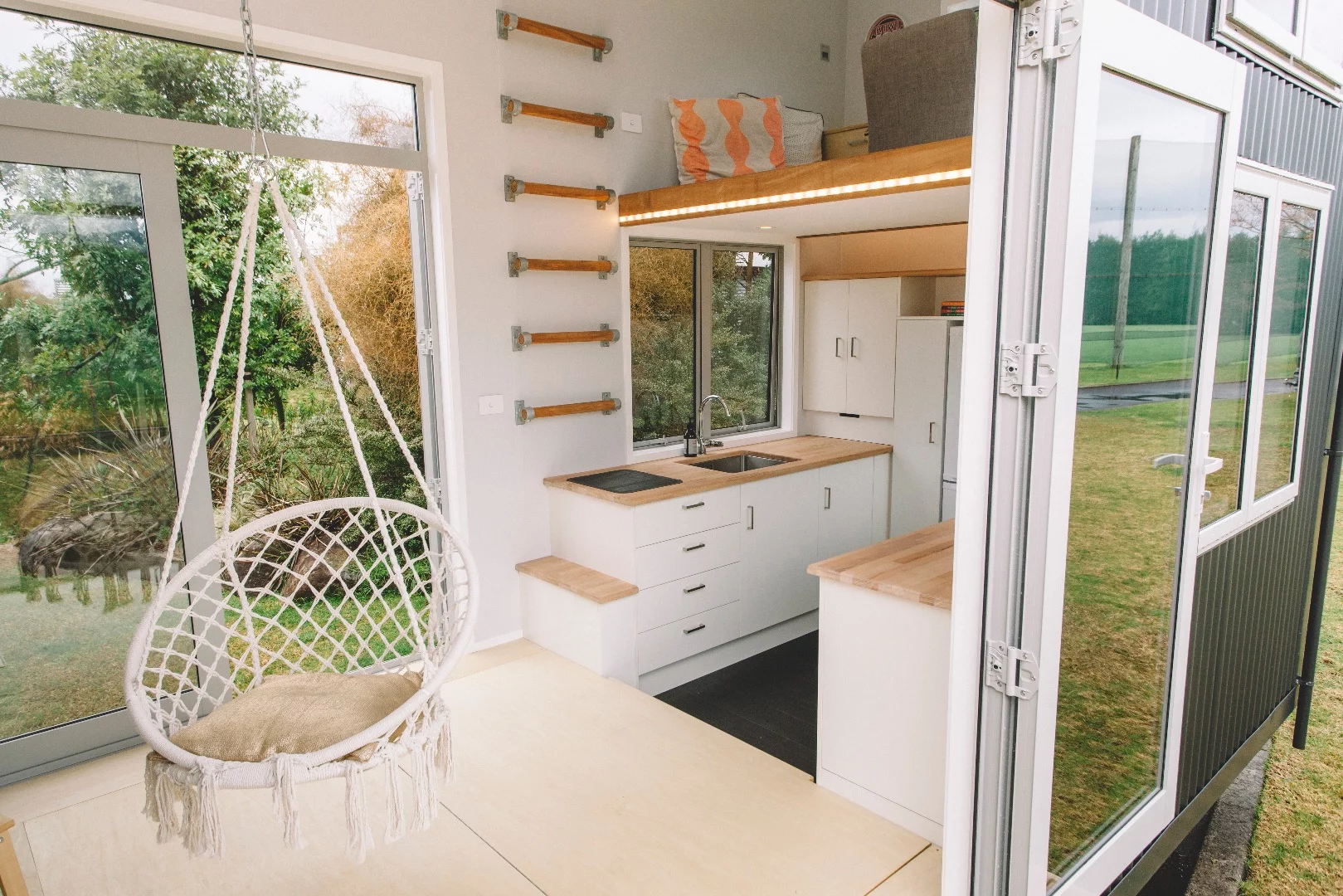 The Millennial Tiny House has two French doors, opening the home to the outside