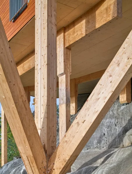 House Dokka is supported by massive wooden columns anchored firmly into the rock foundation