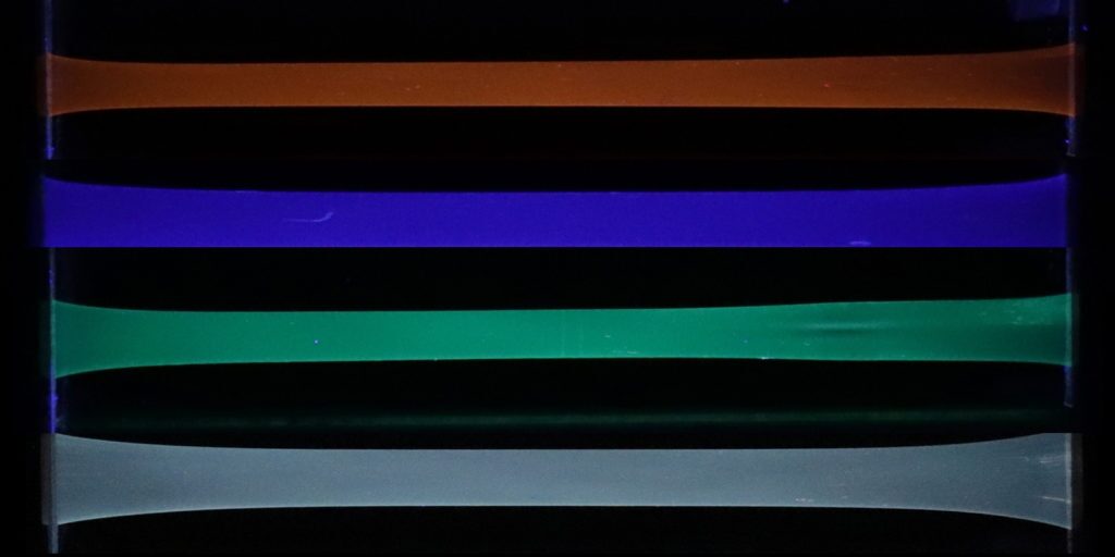 By altering the type of macrocycles used, the polymer can be made to fluoresce blue, green or orange – a white glow can also be produced, by combining them