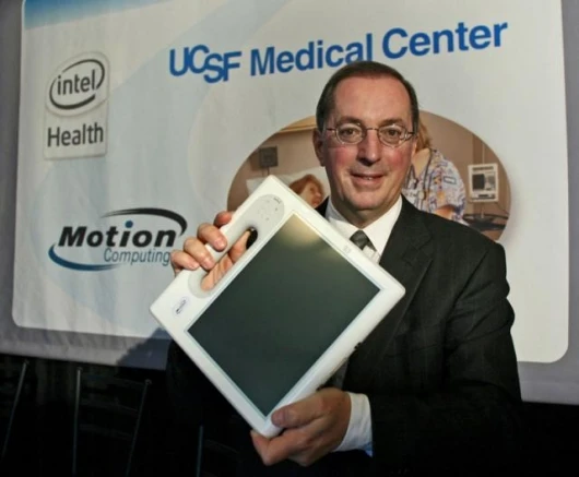 Paul Otellini, president and CEO of Intel Corp., displays Motion Computing's C5, the first product based on Intel's mobile clinical assistant platform, Tuesday, Feb. 20, 2007, at UCSF Medical Center in San Francisco.