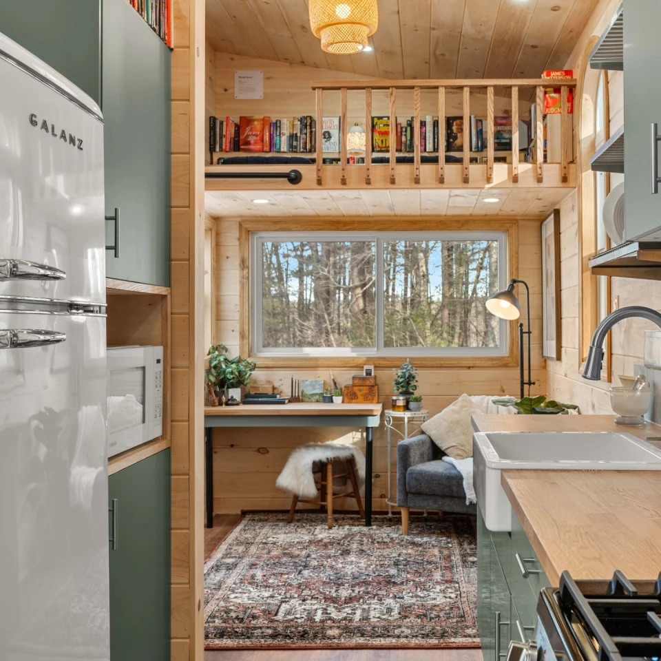 The Library's living room includes an armchair and a desk area - plus a reading lamp of course