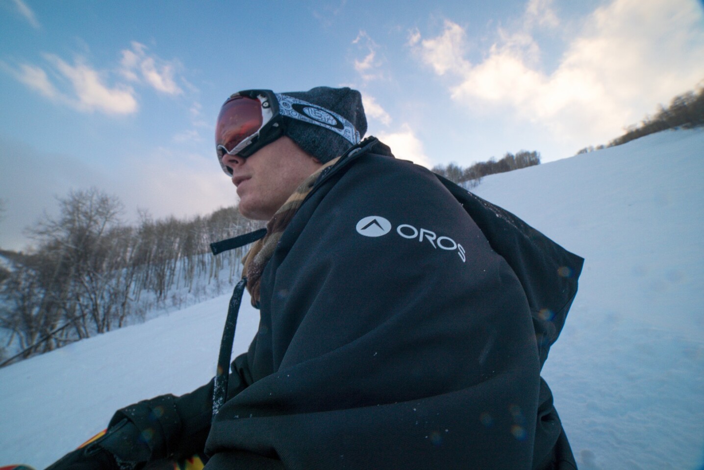 The coat is designed for skiing and similar outdoor activities, with heavy-duty zippers with well-protected teeth, a variety of buttons for added closure, and a zip-off hood