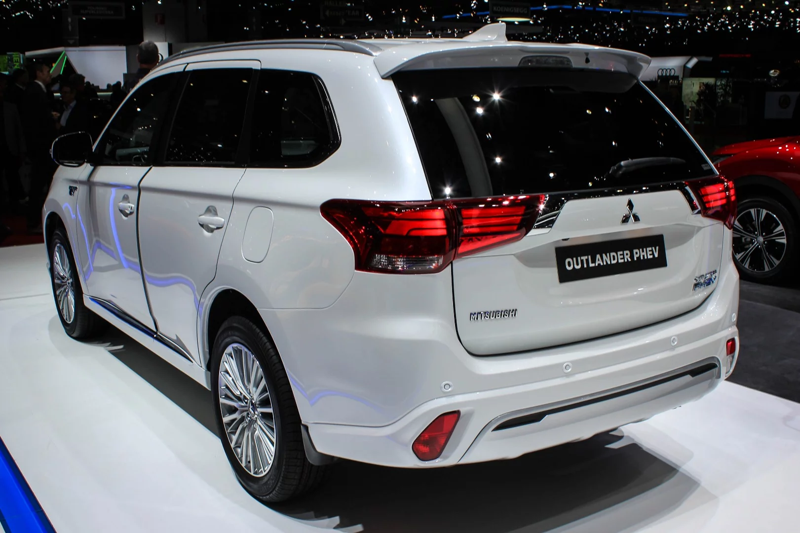 Mitsubishi upgrades the Outlander PHEV with improved output, new Snow and Sport driving modes, a larger 2.4-liter engine, and interior and exterior updates